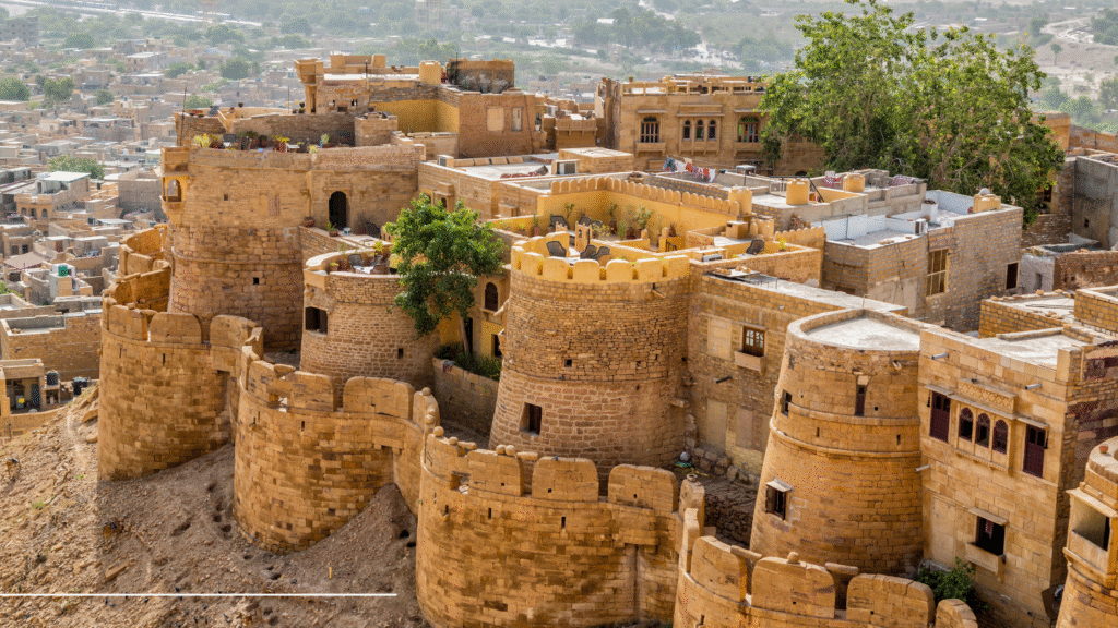 Jaisalmer Golden Fort view with desert safari camels in foreground, Rajasthan India