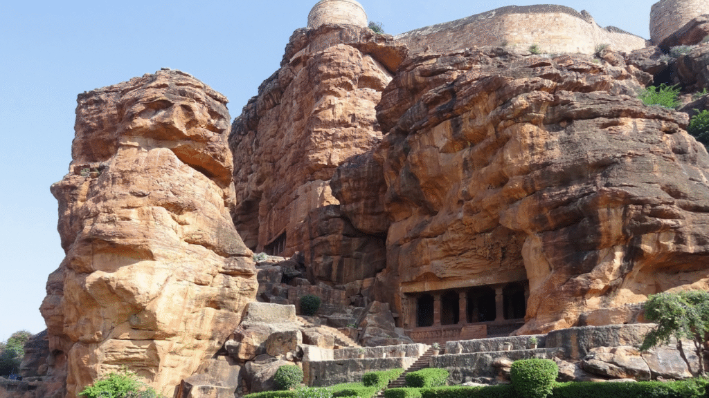 Badami Cave Temples glowing in golden hour light, carved into red sandstone cliffs Top 12 Must-Visit Places in Badami