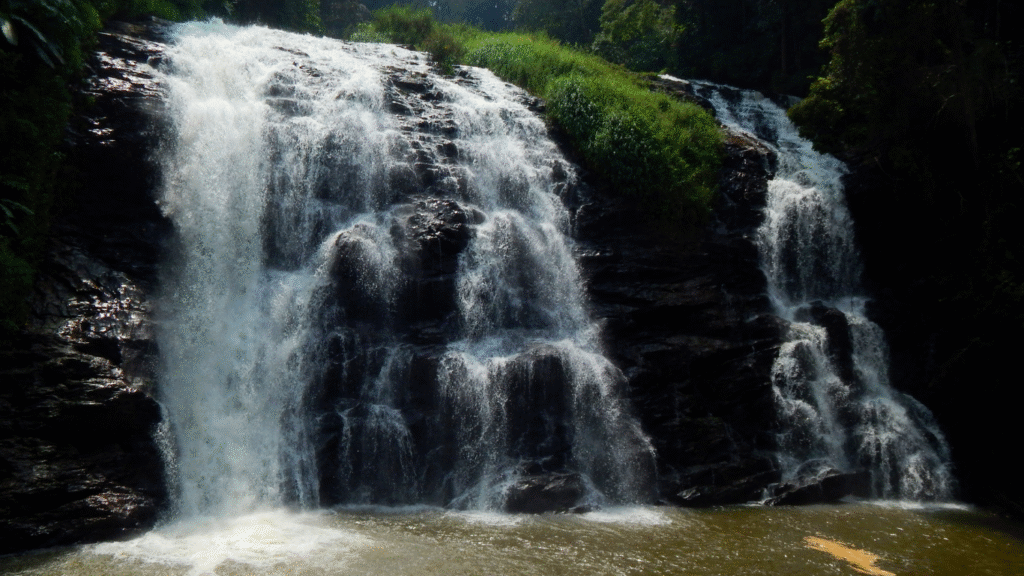 Abbey Falls in Madikeri, a stunning waterfall nestled in a coffee plantation.