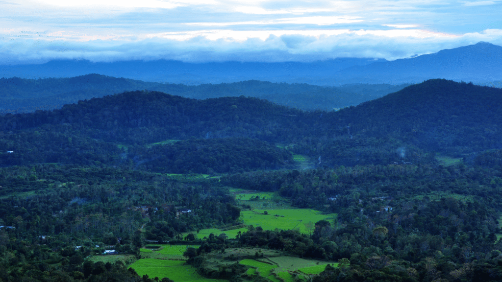 Sunset view from Raja’s Seat in Madikeri, overlooking the Western Ghats.